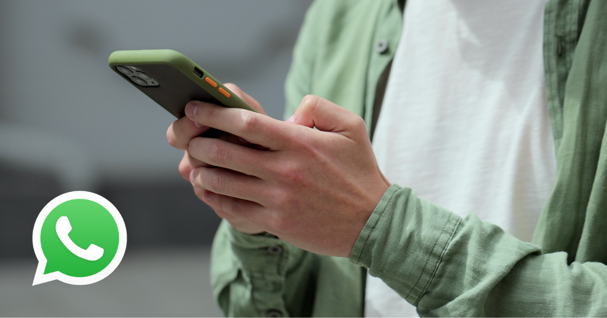 A person holding a smartphone with a WhatsApp logo overlay, representing the shift toward mobile-first WhatsApp marketing in higher education recruitment.