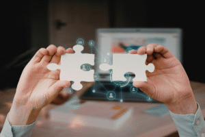 Puzzle pieces connecting to symbolize managing student data across systems in higher education.